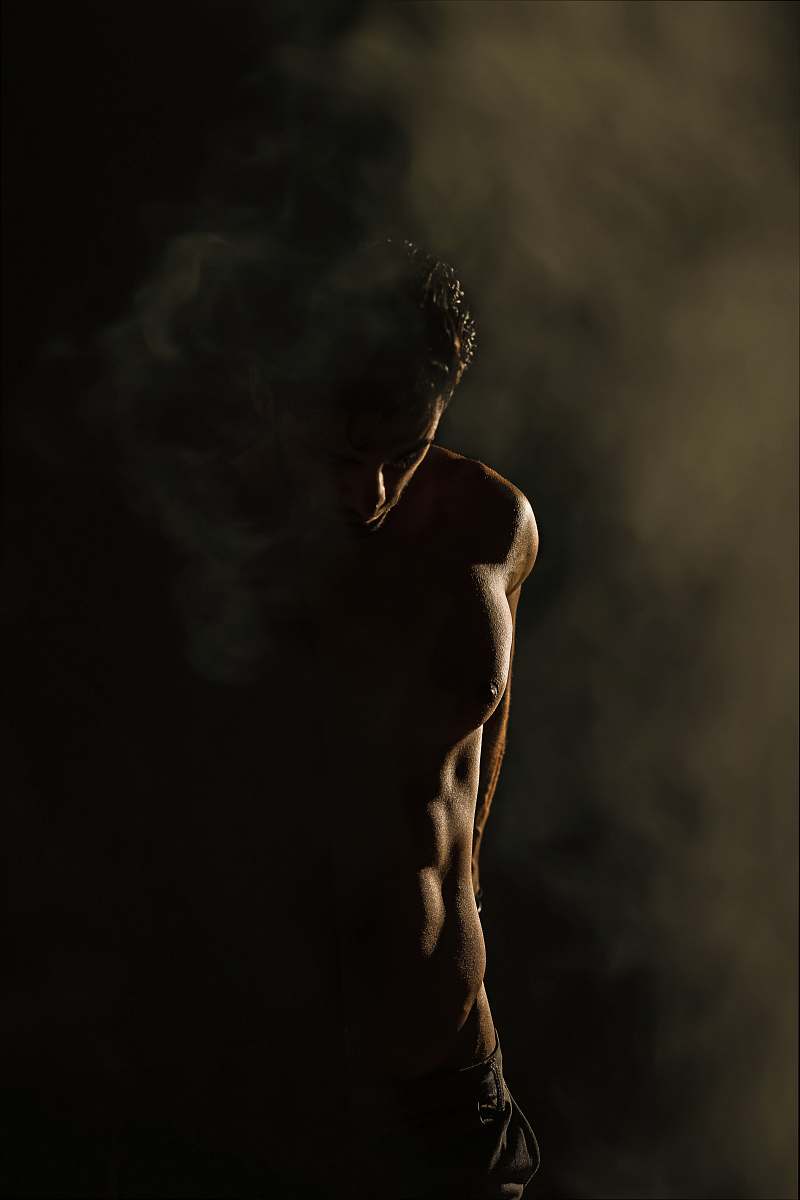 tehran province standing man in dim room iran